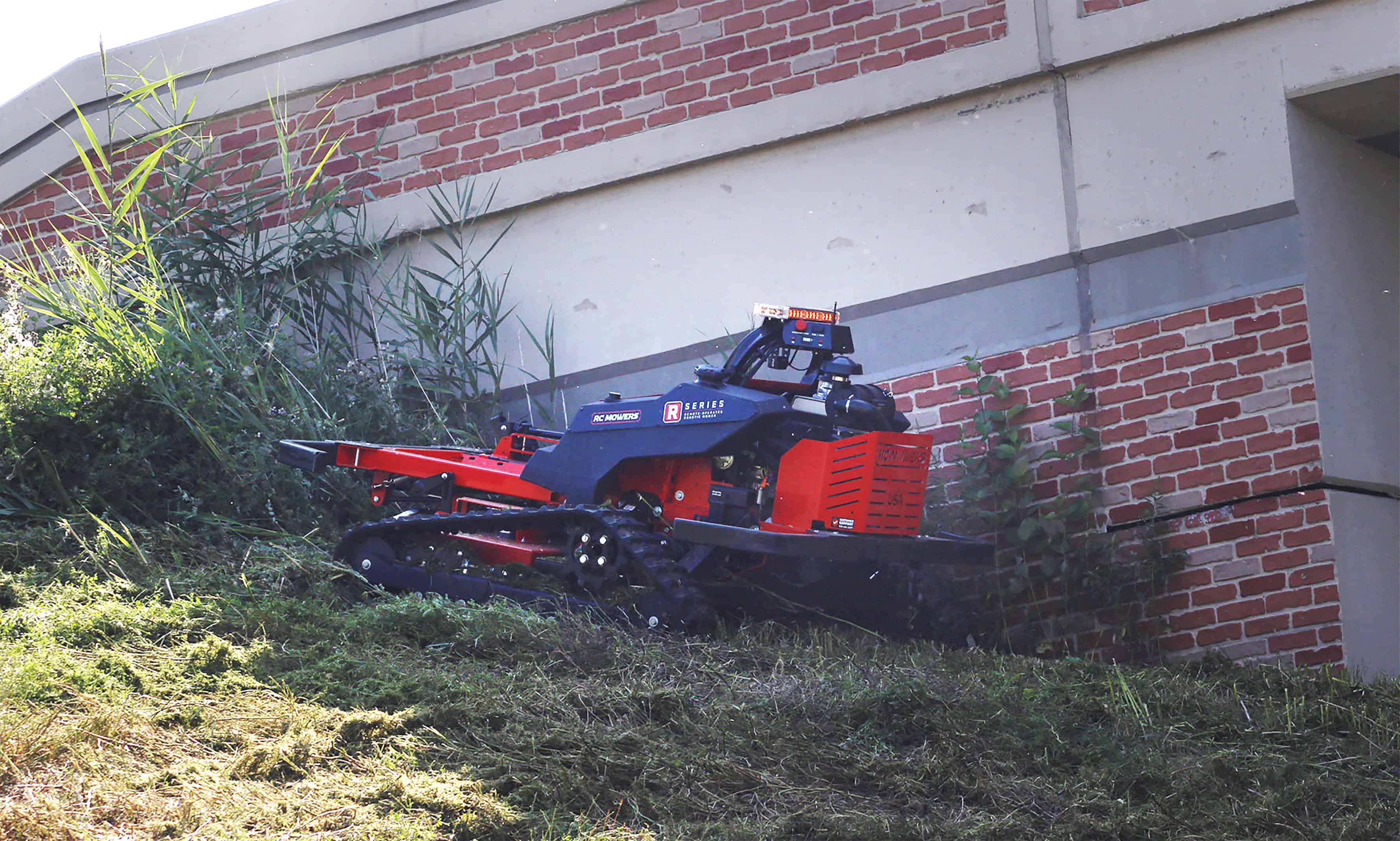 R Series robotic mower on steep slope.