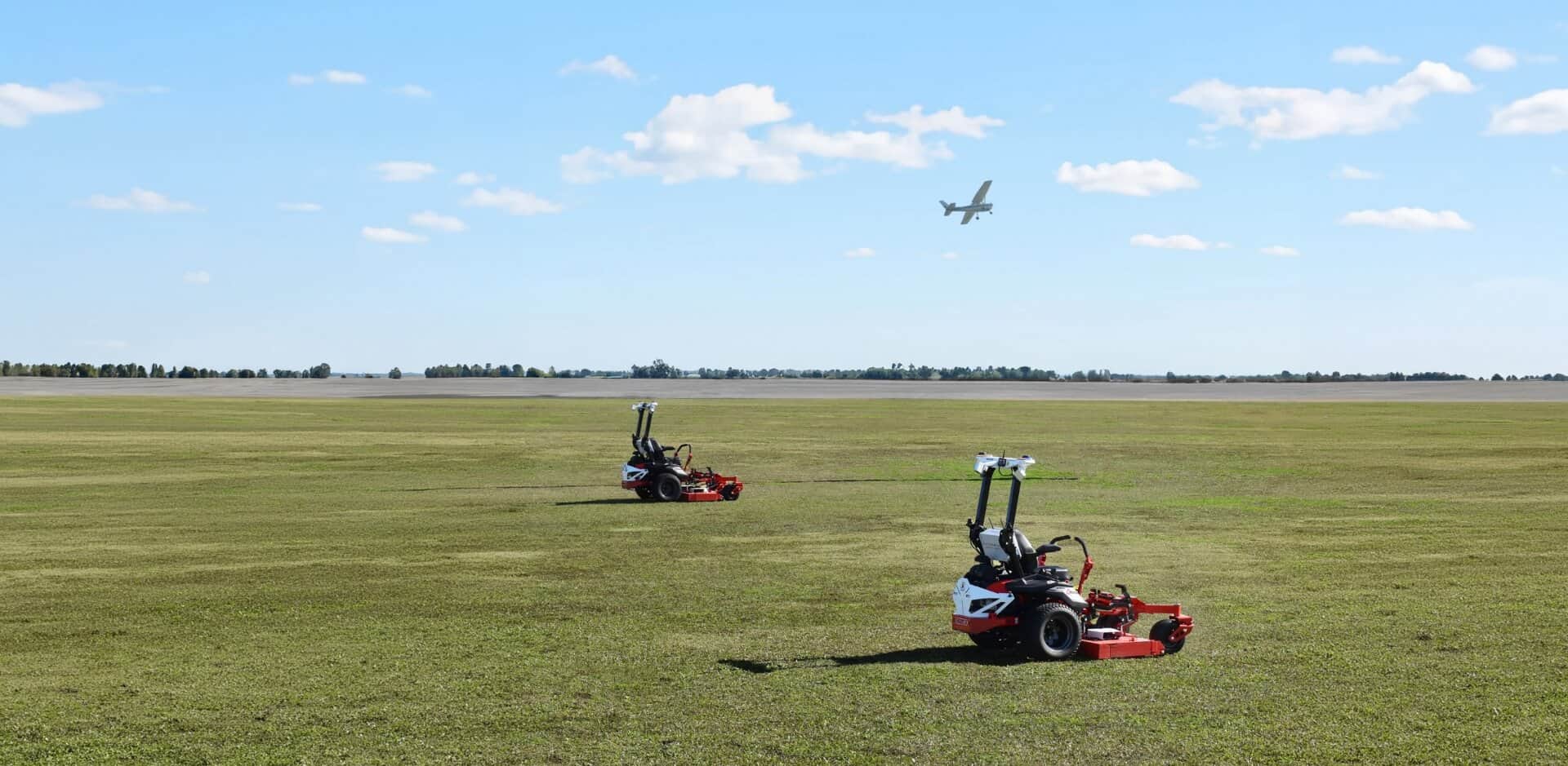 Autonomous mowers mowing at Sugar Land Regional Airport