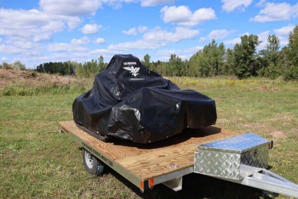 All weather machine storage cover over REAPER on trailer