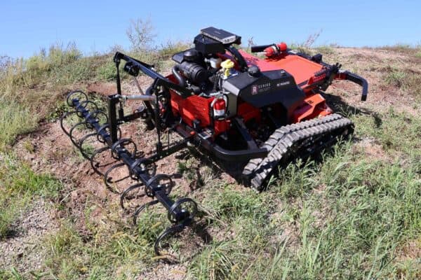 Soil cultivator mounted on back of REAPER on hill